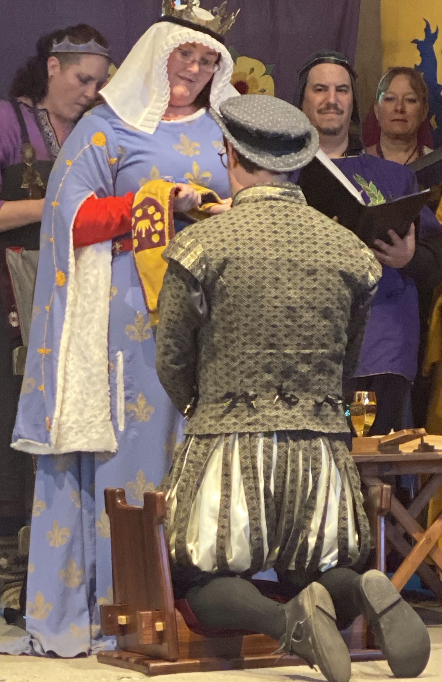 Drake receiving his Queen's Bard baldric from HRM Margarita